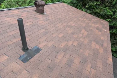 New asphalt shingle roof installation on a residential home in Huntsville, Ontario.